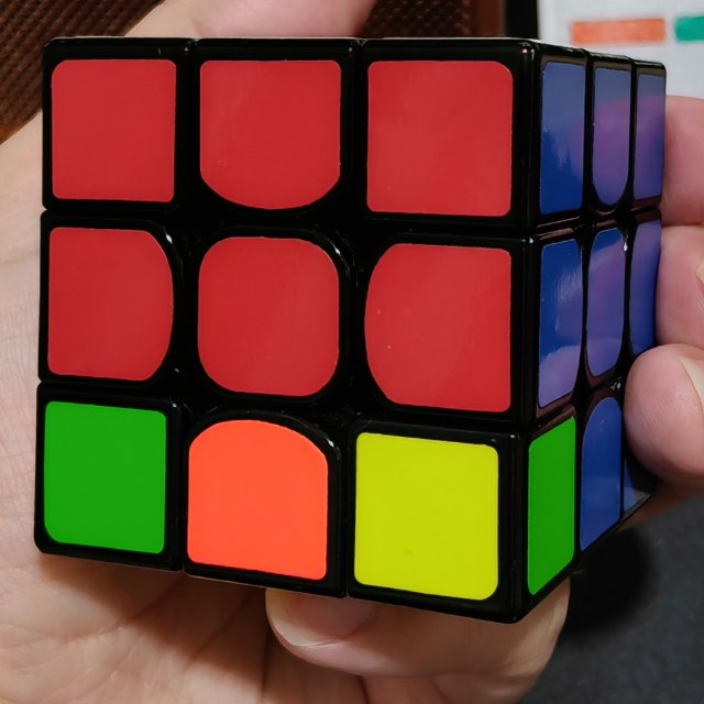 The grid fits the front face; the blue side stays outside it